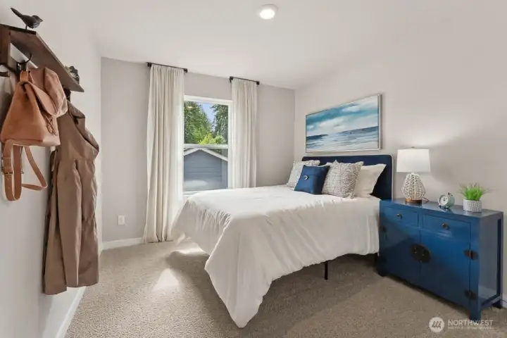 Bedroom 2. Photo rendering is representational and may be virtually staged. Actual home is under construction and finishes, elevation, and paint colors may vary. See site agent for details. Bedroom 2. Photo rendering is representational and may be virtually staged. Actual home is under construction and finishes, elevation, and paint colors may vary. See site agent for details.