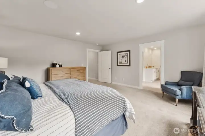 Bright Primary suite. Photo rendering is representational and may be virtually staged. Actual home is under construction and finishes, elevation, and paint colors may vary. See site agent for details. Bright Primary suite. Photo rendering is representational and may be virtually staged. Actual home is under construction and finishes, elevation, and paint colors may vary. See site agent for details.