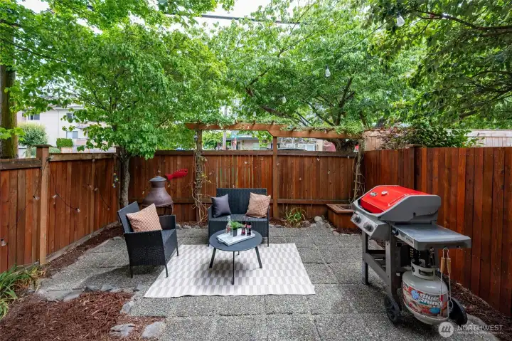 The low maintenance yard is surrounded by a freshly re-stained fence. The low maintenance yard is surrounded by a freshly re-stained fence.