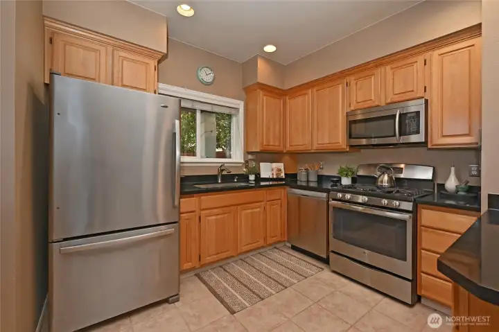 The spacious kitchen offers plenty of storage and counterspace to prepare meals for larger gatherings. The spacious kitchen offers plenty of storage and counterspace to prepare meals for larger gatherings.