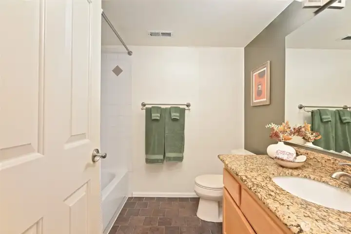 The full lower level bathroom has a 48" vanity and a linen closet in the hall. The full lower level bathroom has a 48" vanity and a linen closet in the hall.