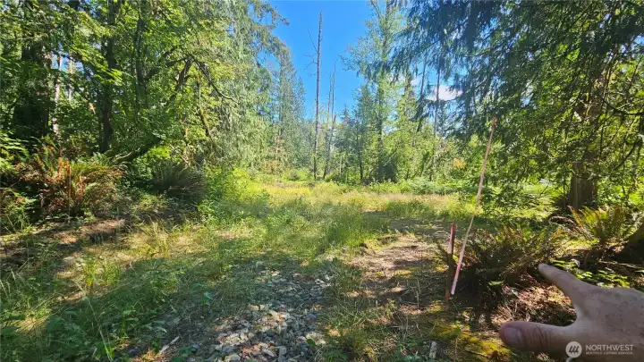 Property starts here at end of access road. Note markers on both sides of road