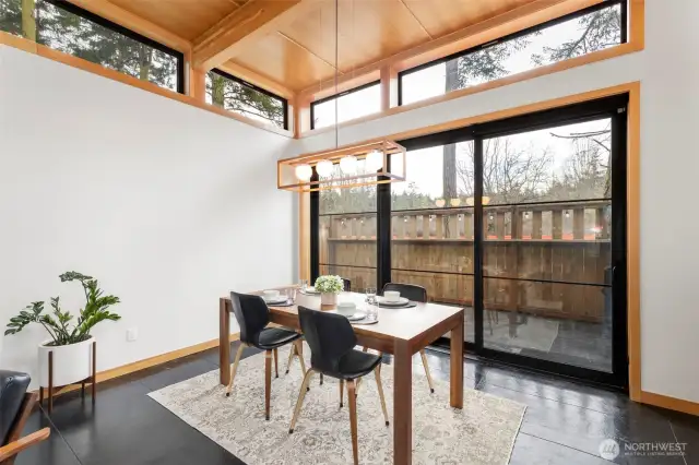 This spacious dining area is perfect for entertaining! A second oversized slider opens onto the front patio.