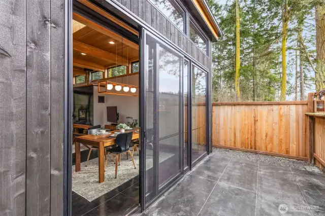 Stained concrete front patio is fenced for privacy and for enjoying those lovely Port Townsend days.