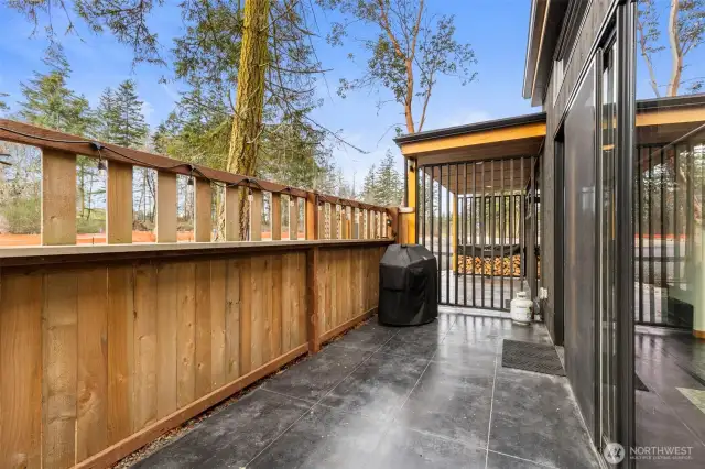 Looking along the patio to the front entry of the home.