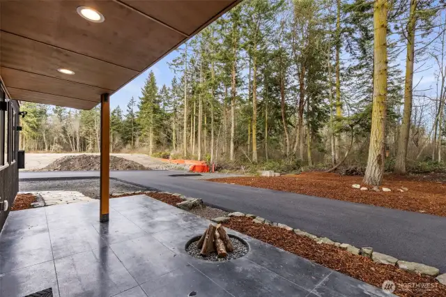 Step outside the living area and enjoy your covered patio and fire pit, rain or shine! Just steps to your newly paved driveway and pristine landscaping.