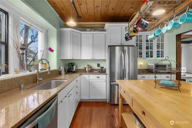 Hardwood floors and pine ceilings make this room POP.