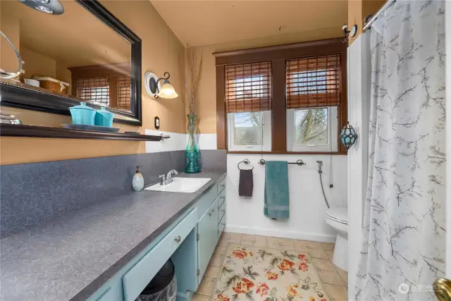 Upper level bathroom has a lot of storage and plenty of counterspace.