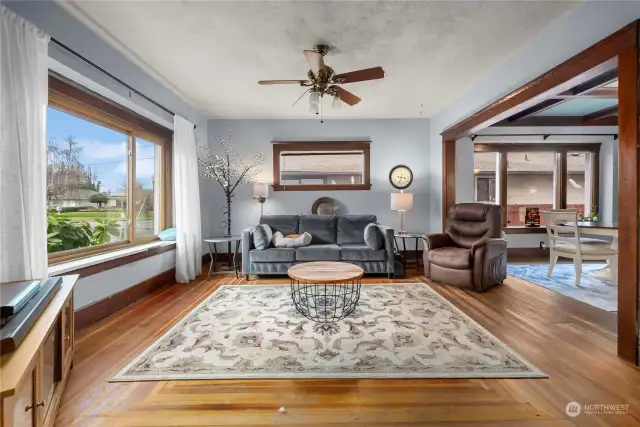 As you enter, notice the large, triple-paned windows - letting all the natural light in. Original fir flooring thru-out the home can be refinished- or add your favorite flooring.