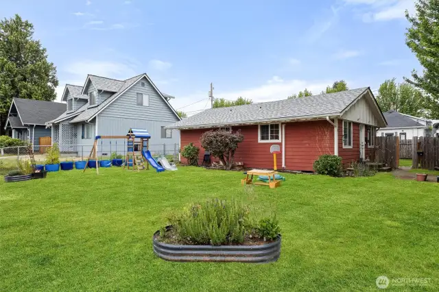 Front Yard has room for a play area and gardening with raised beds for plantings.
