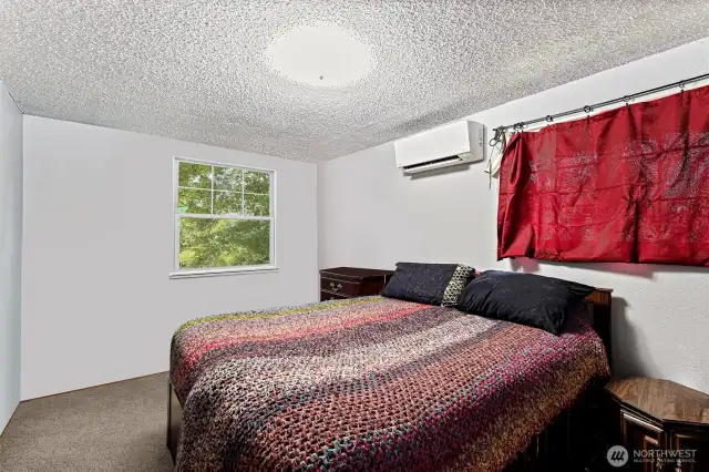 Cozy Main Bedroom with Ductless Mini-Split HVAC unit including Air Conditioning for cooling.