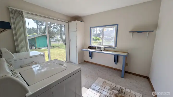 Laundry/utility room with sliding doors to spacious yard