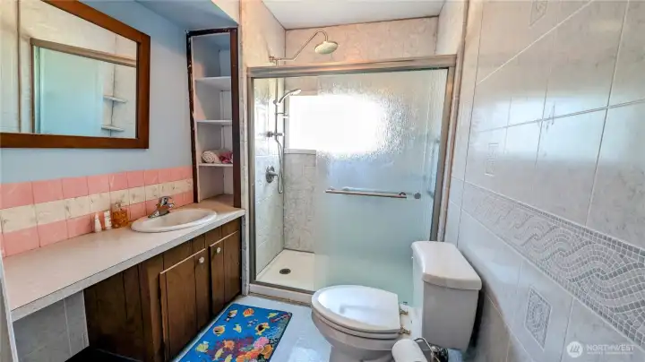 Charming bathroom with updated shower.