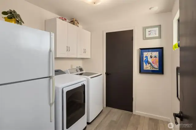 New Washer and Dryer and a powder room is conveniently located off the kitchen space.