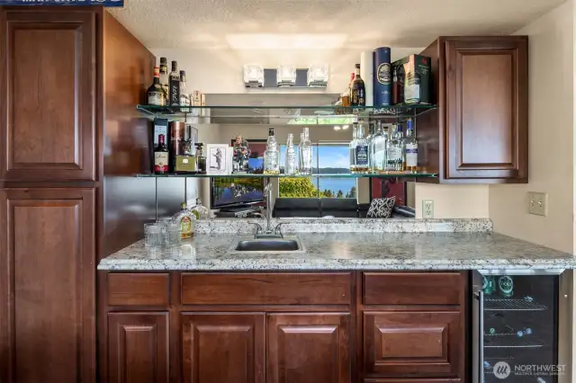 The wet bar is a must when everyone is over to watch a game.
