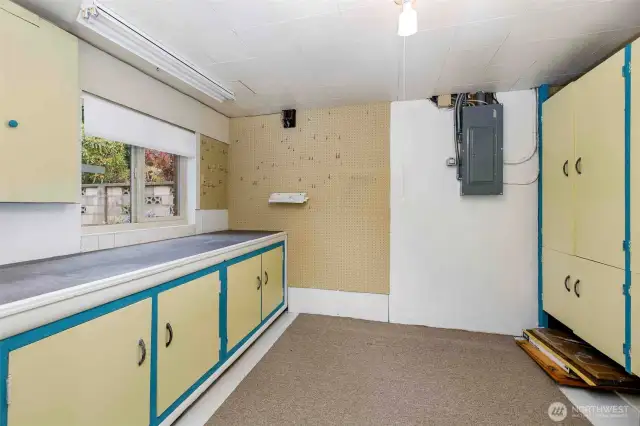 Versatile workshop or craft area with ample space for projects, storage, and hobbies—plus direct access to the backyard.