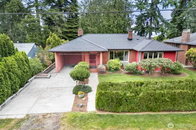 Classic mid-century curb appeal in the heart of Broadview, with manicured landscaping, lush greenery, and a newly replaced roof. Peaceful setting just minutes from Carkeek Park and the Puget Sound.