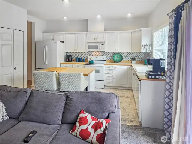 View of family room to kitchen.  Lots of space in this townhome!