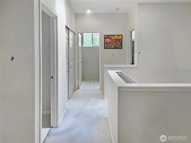 View to the second bedroom, bath and upstairs laundry area.