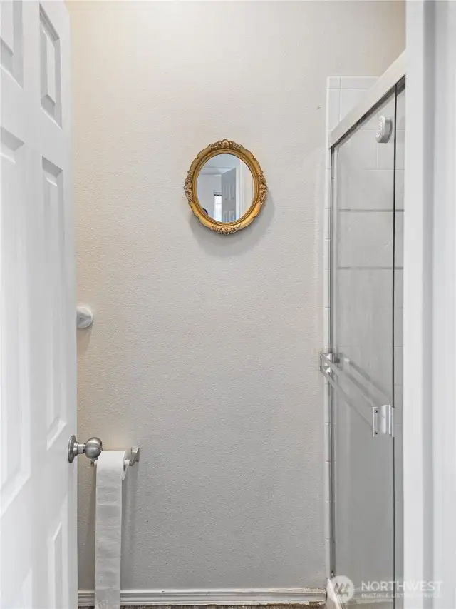 Toilet and shower are conveniently located in a seperate room.