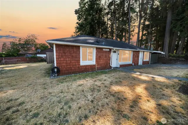 Warm, welcoming, and beautifully lit — this inviting exterior sets the tone for a home that’s been thoughtfully updated inside and out.