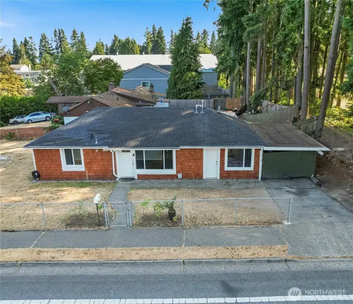 Warm, welcoming, and beautifully lit — this inviting exterior sets the tone for a home that’s been thoughtfully updated inside and out. Convenient single-car attached carport for easy, covered parking.
