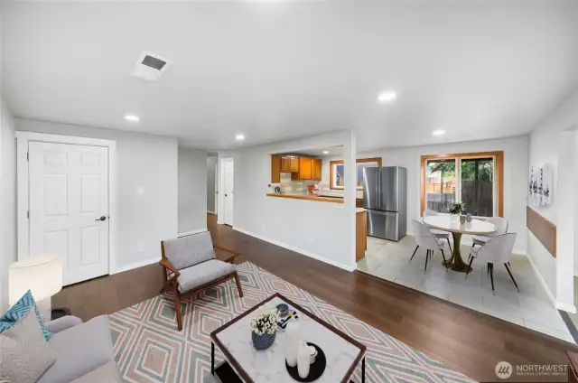 An open and inviting layout connects the living and dining spaces, creating the perfect spot to relax or entertain. *virtually staged*
