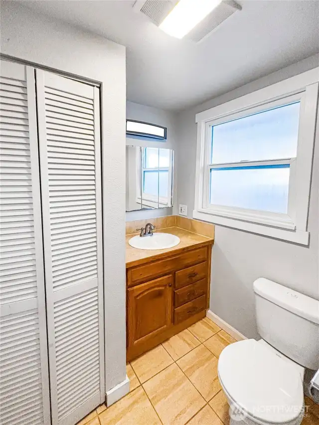 The primary bedroom includes its own private ensuite bathroom, offering convenience and a personal space to unwind.
