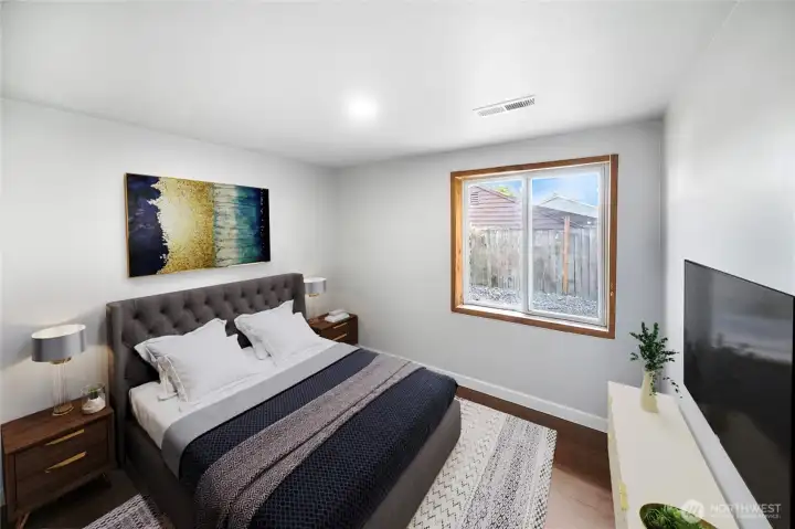This bright and inviting bedroom pairs perfectly with the home’s fresh finishes. *virtually staged*