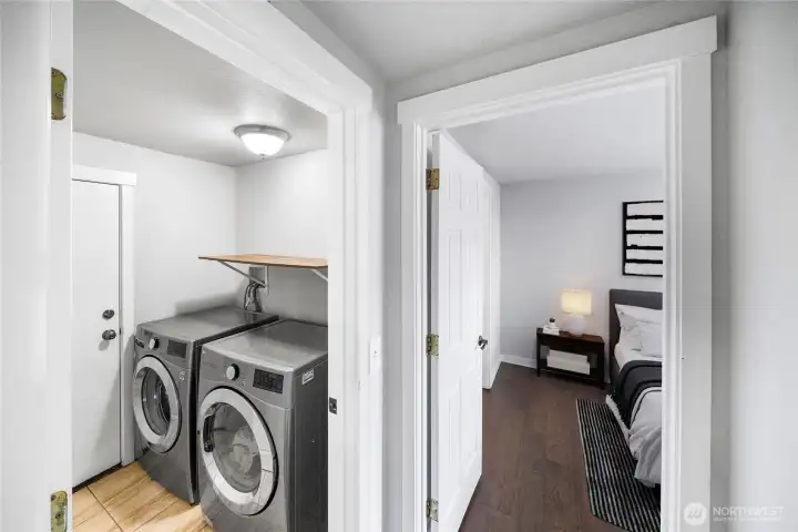 With matching LVP floors and its own dedicated space, the laundry room offers functionality and style.  *virtually staged*
