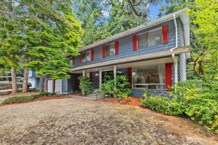 Two-story home with covered front porch entrance.