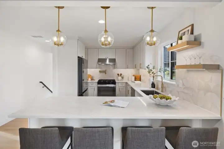 Gather around the generous sized peninsula with eating bar ideal for every day meals and connection