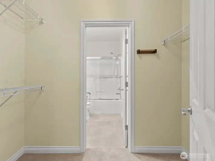 The walk-through closet is a great size for your wardrobe.