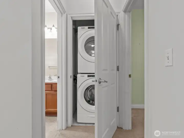 On the other side of the condo is a full size, in unit washer and dryer.