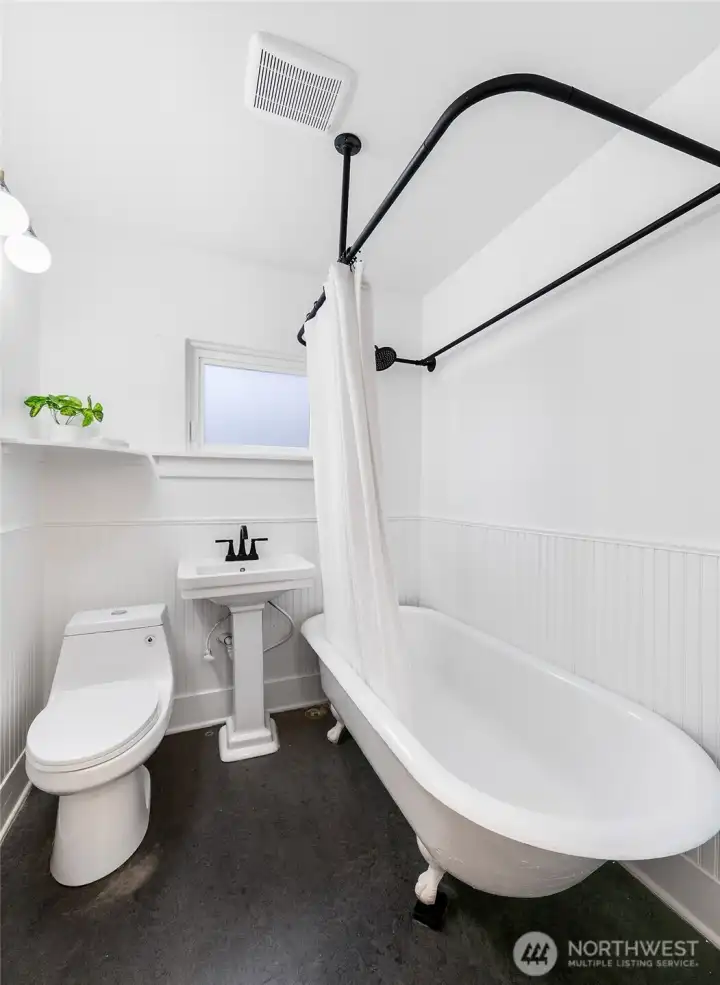 Full bathroom with clawfoot tub