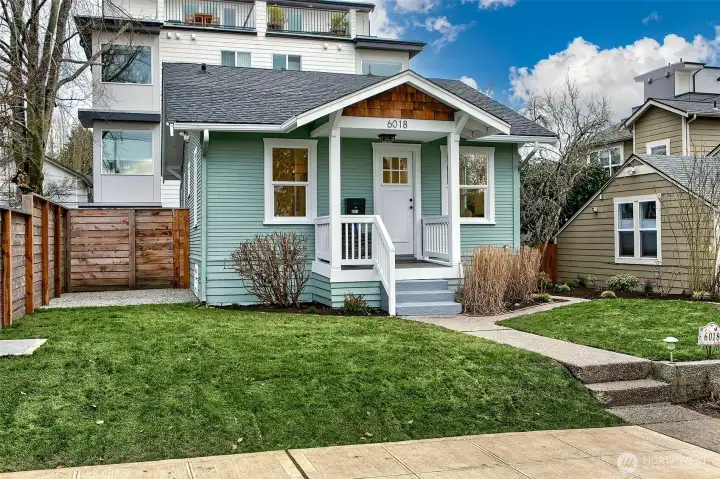 Front of home! Newer landscaping and plantings.  Some nice mature roses and more.