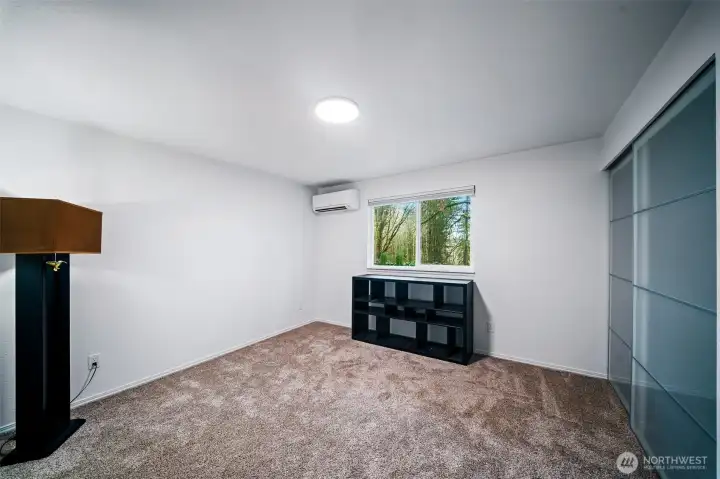Bedroom number two is also large enough to hold a king size bed. Large closet with glass doors and built in storage shelving