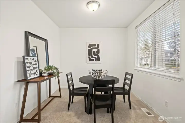 Welcoming dining room sits to the right as you enter