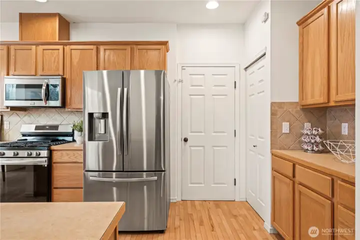 Pantry and  to the right is the door to the 2-car garage