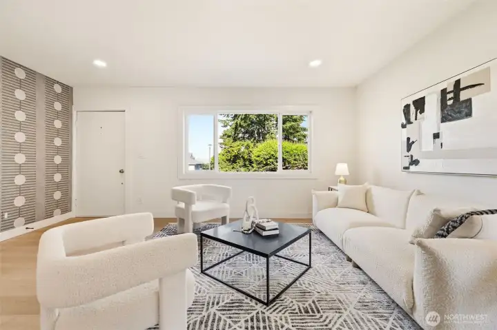 A well-proportioned living room offering a comfortable setting for relaxing or entertaining.