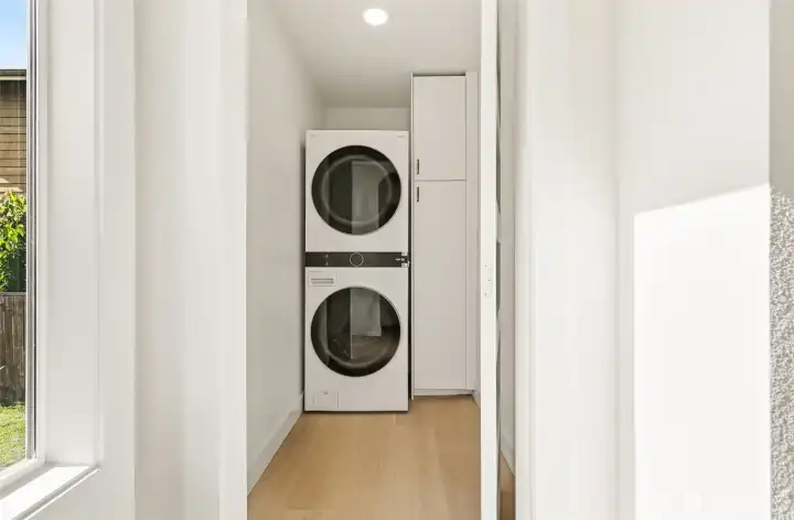 Freshly upgraded laundry area with new stackable washer and dryer designed for everyday ease.