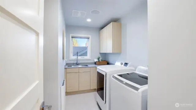 Laundry room on 2F with custom-built cabinetry