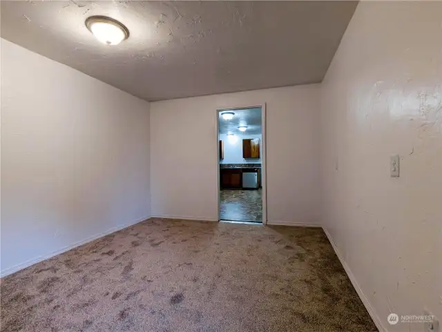 Another view in the bonus room toward the kitchen