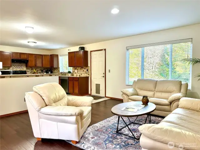 Living room looking onto kitchen area.