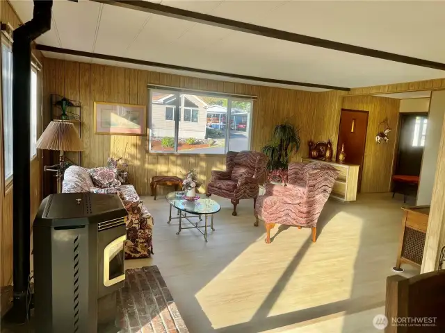 This elegant living room with its cozy pellet stove to take the chill off those cold winter evenings.