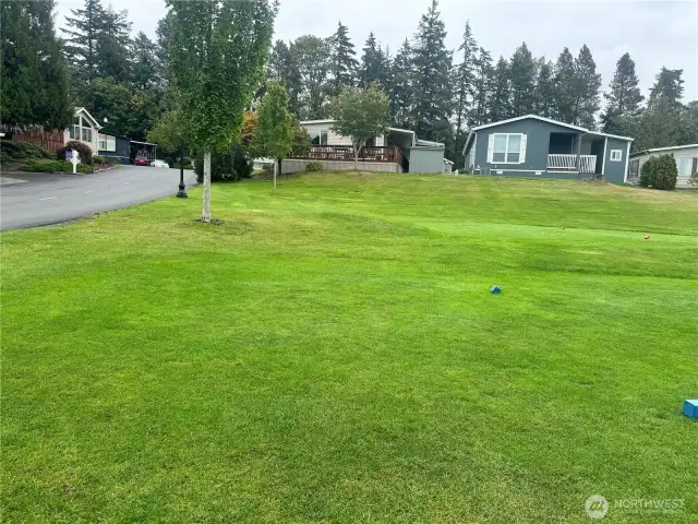 The lovely home is the one on the left, from the beautiful golf course. This is the 5th tee.