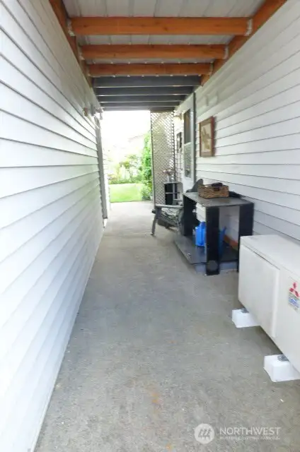 Covered breezeway. Notice the Mitsubishi heat pump.