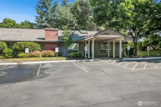 Community clubhouse with outdoor pool, hot tub, and party room.