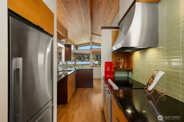 A view through to the dining room, deck and views beyond.