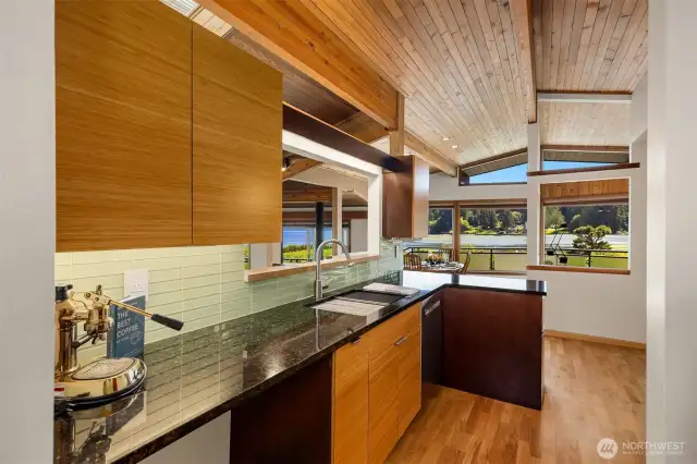 Sheek kitchen design. Amazing work station sink.
